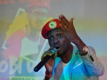 Ugandan pop star turned opposition MP Robert Kyagulanyi, popularly known by pop name Bobi Wine, listens to presentation at the PAWA 254 offices in October 12, 2018, Nairobi, where he met the youth and spoke on several issues affecting the youth in East Africa. (Photo by SIMON MAINA / AFP) …