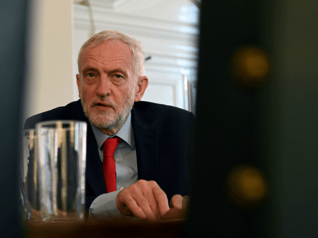 Britain's opposition Labour Party leader, Jeremy Corbyn, poses for a photograph as he prepares to meet with leaders of Britain's other political parties to discuss options for Brexit, in Portcullis House, central London on August 27, 2019. - Labour leader Jeremy Corbyn will on Tuesday attempt to bridge deep divisions …