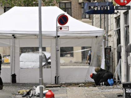 Danish police technicians inspect the scene outside of a local police station in a neighborhood of Copenhagen, Saturday, Aug. 10, 2019 after it was hit by an explosion early morning. This follows-on from Tuesday's explosion which occurred outside the Danish Tax Agency's office in Copenhagen. (Philip Davali/Ritzau Scanpix via AP)