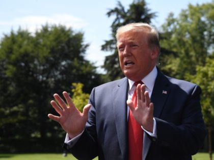 US President Donald Trump speaks to the media as he departs the White House in Washington,