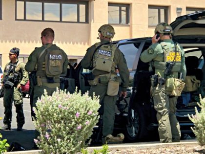Law enforcement from different agencies work the scene of a shooting at a shopping mall in El Paso, Texas, on Saturday, Aug. 3, 2019. Multiple people were killed and one person was in custody after a shooter went on a rampage at a shopping mall, police in the Texas border …