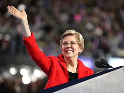 PHILADELPHIA, PA - JULY 25: Sen. Elizabeth Warren (D-MA) acknowledges the crowd as she walks on stage to deliver remarks on the first day of the Democratic National Convention at the Wells Fargo Center, July 25, 2016 in Philadelphia, Pennsylvania. An estimated 50,000 people are expected in Philadelphia, including hundreds …
