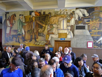 People fill the main entryway of George Washington High School to view the controversial 13-panel, 1,600-square foot mural, the "Life of Washington," during an open house for the public Thursday, Aug. 1, 2019, in San Francisco. More than a 100 people packed the public high school to view a controversial …