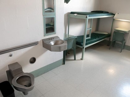 A bunk bed, desks, toilet and sink inside a cell are seen at the Caroline Detention Facility in Bowling Green, Virginia, on August 13, 2018. - A former regional jail, the facility has been contracted by the US Department of Homeland Security Immigration and Customs Enforcement (ICE) to house undocumented …
