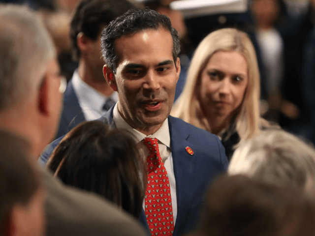 George P. Bush greets mourners in front of the casket of his grandfather the late former P