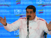 Venezuela's President Nicolas Maduro gestures while delivering a speech in the framework of the "Youth Day" celebrations at the Bolivar Square in Caracas, Venezuela on February 12, 2019. - Venezuela's opposition leader Juan Guaido told tens of thousands of supporters on Tuesday that desperately-needed humanitarian aid would be brought into …