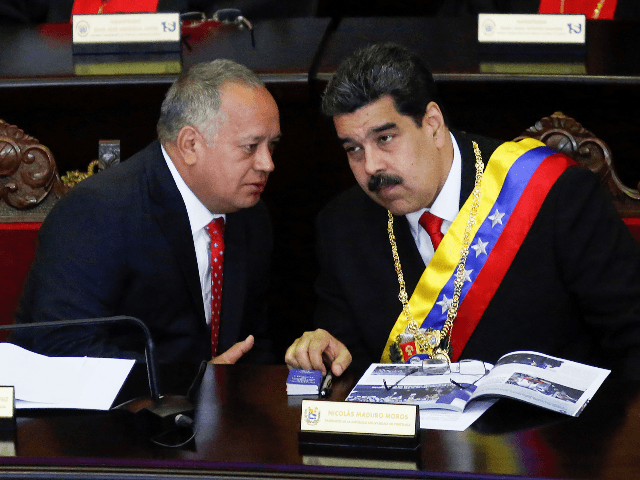 President of Venezuela Nicolás Maduro (R) talks to President of the Constituent Assembly
