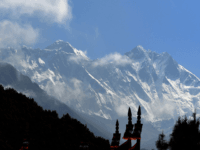 Mount Everest (height 8848 metres) is seen in the Everest region, some 140 km northeast of Kathmandu, on May 27, 2019. - Ten people have died in little more than two weeks after poor weather cut the climbing window, leaving mountaineers waiting in long queues to the summit, risking exhaustion …