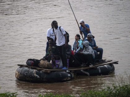 African migrants and locals use a makeshift raft to illegaly cross the Suchiate river from Tecun Uman in Guatemala to Ciudad Hidalgo in Chiapas State, Mexico, on June 10, 2019. - In the framework of Mexico's deal to curb migration in order to avert US President Donald Trump's threat of …