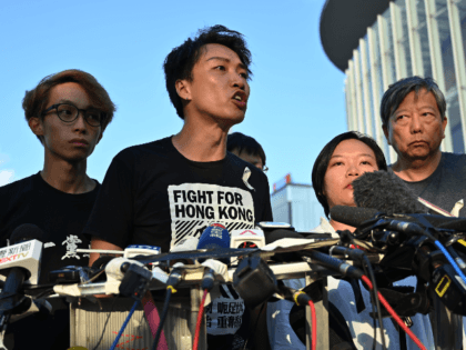 Civil Human Rights Front (CHRF) member Jimmy Sham (C) speaks during a press conference in Hong Kong on June 15, 2019 after Hong Kong Chief Executive Carrie Lam suspended a hugely divisive bill that would allow extraditions to China in a major climbdown after a week of unprecedented protests and …