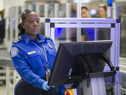 MIAMI, FLORIDA - MAY 21: Transportation Security Administration (TSA) agent, Roselie Pierre, keeps an eye on the 3-D scanner screen at the Miami International Airport on May 21, 2019 in Miami, Florida. TSA has begun using the new 3-D computed tomography (CT) scanner in a checkpoint lane to detect explosives …
