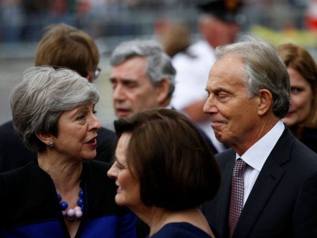British Prime Minister Theresa May (L) speaks with former British Prime Minister Tony Blair after attending a service of thanksgiving for Lord Heywood in Westminster Abbey in London on June 20, 2019. (Photo by HENRY NICHOLLS / POOL / AFP) (Photo credit should read HENRY NICHOLLS/AFP/Getty Images)