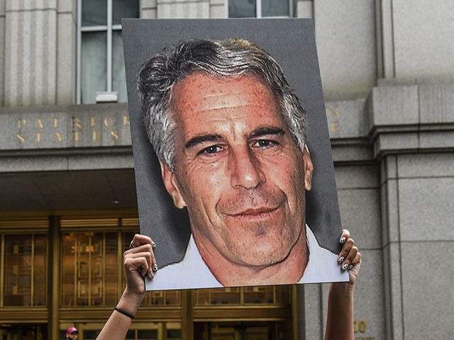 NEW YORK, NY - JULY 08: A protest group called "Hot Mess" hold up signs of Jeffrey Epstein in front of the federal courthouse on July 8, 2019 in New York City. According to reports, Epstein will be charged with one count of sex trafficking of minors and one count …
