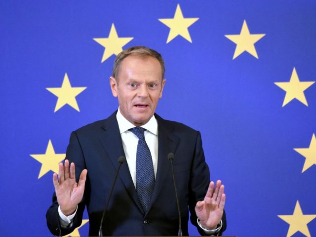 European Council President Donald Tusk gastures as he speaks during a press conference on