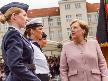 BERLIN, GERMANY - JULY 20: German Chancellor Angela Merkel (R) talks to soldiers during an