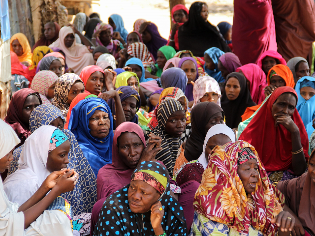 Women gather during a burial ceremony, after two people were killed by Boko Haram fighters in Dalori camp for internally displaced people, near Maiduguri, on July 26, 2019. - Two people were killed and several wounded when Boko Haram fighters raided a camp for people displaced by the jihadist conflict …