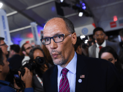 Chair of the Democratic National Committee, Tom Perez, makes his way through the spin room