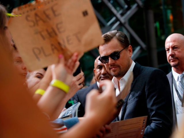 US actor Leonardo DiCaprio signs autographs as he arrives for the German Premiere of US di