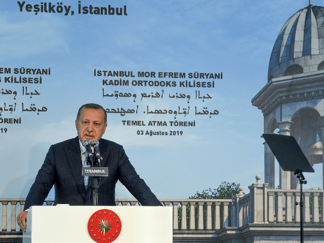 Turkish President Recep Tayyip Erdogan delivers a speech during the first stone ceremony o