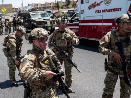 Border Patrol agents and CBP officers provide assistance to El Paso Police Department officers at the scene of the Walmart Shooing on Aug, 3. (Photo: JOEL ANGEL JUAREZ/AFP/Getty Images)