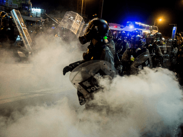 Police fire tear gas during a protest in the district of Causeway Bay in Hong Kong on Augu