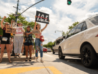 People hold up signs protesting against the U.S. Immigration and Customs Enforcement agency on August 10, 2019 in New York City. Protesters are demanding the U.S. Immigration and Customs Enforcement agency be abolished and the closure of an I.C.E. Homeland Security Investigations office located at 601 West 26 Street. (Photo …