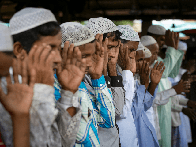 Rohingya Muslims celebrate Eid al-Adha in a refugee camp August 12, 2019 in Cox's Bazar, Bangladesh. Eid al-Adha, or the Festival of Sacrifice, marks the end of the Hajj pilgrimage to Mecca and in commemoration of Prophet Abraham's readiness to sacrifice his son to show obedience to God. Muslims slaughter a sacrificial animal and split the meat into three parts, one for the family, one for friends and relatives, and one for the poor and needy. (Photo by Allison Joyce/Getty Images)