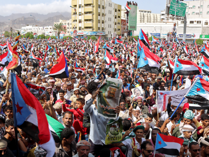 Yemeni Southern separatists supporters wave flags of the former South Yemen (The People's Democratic Republic of Yemen) as they demonstrate in the Khormaksar district of Yemen's second city of Aden on August 15, 2019. - Yemen's government on August 14 ruled out talks with southern separatists until they withdraw from …