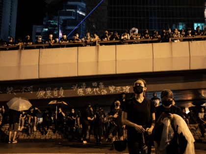 A protester uses a laser pointer outside the Central Government complex after a march during a demonstration on August 18, 2019 in Hong Kong, China. Pro-democracy protesters have continued rallies on the streets of Hong Kong against a controversial extradition bill since 9 June as the city plunged into crisis …