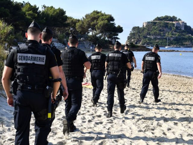 French Gendarmes patrol the beach in the vicinity of the French President' summer ret