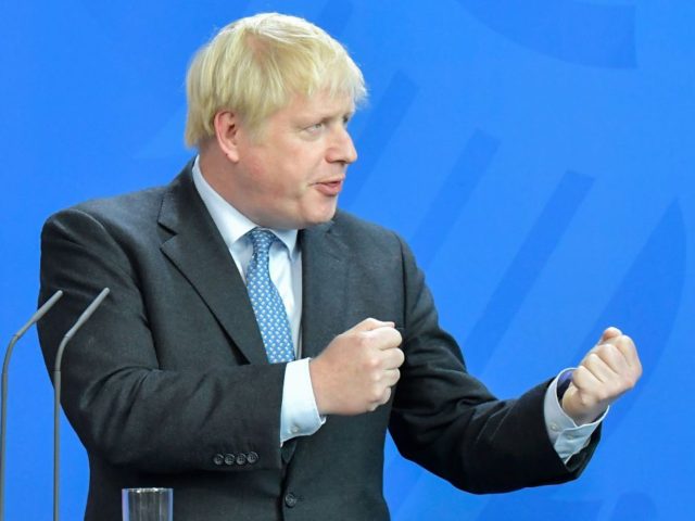 British Prime Minister Boris Johnson speaks to journalists with the German Chancellor at t