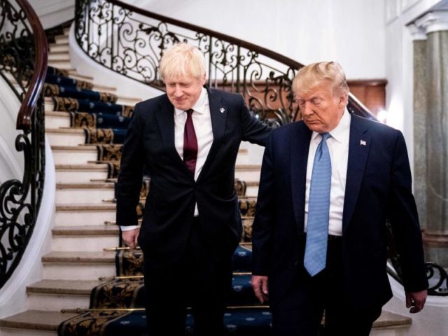 US President Donald Trump (R) and Britain's Prime Minister Boris Johnson walk to a working breakfast at the G7 Summit in Biarritz, France on August 25, 2019, on the second day of the annual G7 Summit attended by the leaders of the world's seven richest democracies, Britain, Canada, France, Germany, …