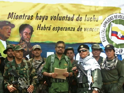 This TV grab taken from youtube and released on August 29, 2019 shows former senior commander Ivan Marquez(C) and fugitive rebel colleague, Jesus Santrich(wearing sunglass), of the dissolved FARC rebel army group in Colombia, on an undisclosed location of Colombia announcing that they are taking up arms again along with …