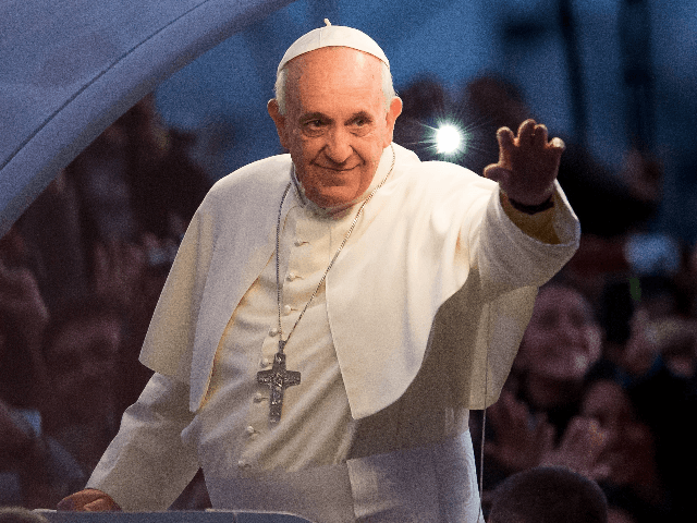 Pope Francis waves from the Popemobile on his way to attend the Via Crucis on Copacabana Beach during World Youth Day celebrations on July 26, 2013 in Rio de Janeiro, Brazil. More than 1.5 million pilgrims are expected to join the pontiff for his visit to the Catholic Church's World …
