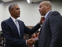 WASHINGTON, DC - SEPTEMBER 18: (AFP OUT) U.S. President Barack Obama (L) greets Sen. Corey Booker (D-NJ) during a gathering of actors, hip-hip artists, justice activists, state and local elected officials and community leaders advocating for criminal justice reform in the Eisenhower Executive Office Building South Court Auditorium September 18, …