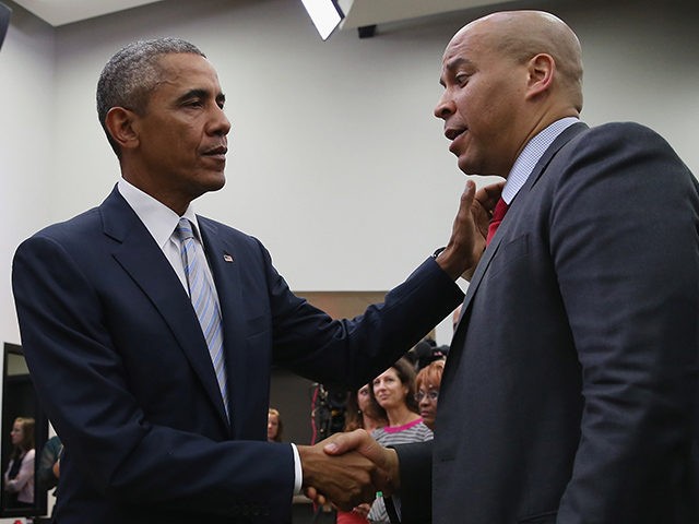 WASHINGTON, DC - SEPTEMBER 18: (AFP OUT) U.S. President Barack Obama (L) greets Sen. Corey