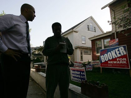 NEWARK, NJ - MAY 04: Cory Booker, a Democratic candidate for mayor of Newark, campaigns May 04, 2006 in Newark, New Jersey. Booker, who holds degrees from Yale, Oxford and Stanford, is running for mayor for the second time after narrowly loosing in 2002 to long-time Mayor Sharpe James. James …