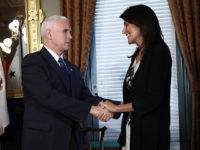 WASHINGTON, DC - JANUARY 25: (AFP-OUT) U.S. Vice President Mike Pence (C) congratulates Nikki Haley at the end of the ceremomy where she was sworn in as the U.S. Ambassador to the United Nations January 25, 2017 in Washington, DC. Haley was formerly the Governor of South Carolina. Also pictured …
