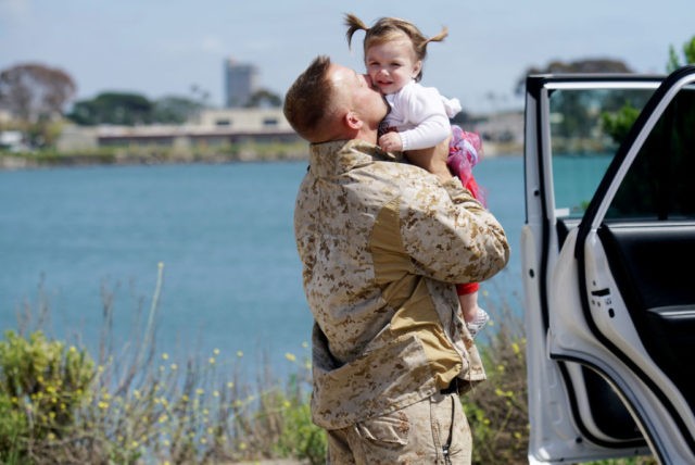 Gunnery Sgt. Michel Grabau hugs his daughter Mikaelie during a homecoming reception at Camp Pendleton in Oceanside, California on May 11, 2017.