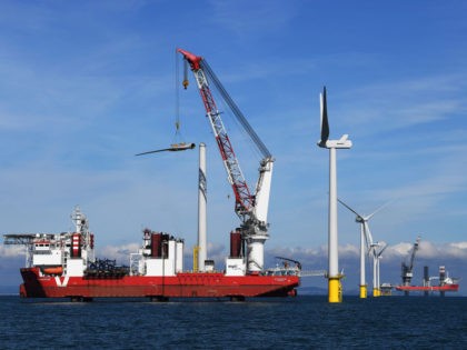BRIGHTON, ENGLAND - SEPTEMBER 20: One of the final 55m turbine blades is manoeuvred into position on September 20, 2017 in Brighton, England. The last of 116 wind turbines have been installed at the Rampion Offshore Wind Farm 13 kms off the Sussex Coast. It will provide enough electricity to …