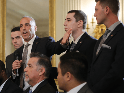 Andrew Pollack (2nd L), whose daughter Meadow Pollack was shot to death last week at Marjory Stoneman Douglas High School, is joined by his sons as he addresses a listening session with U.S. President Donald Trump in the State Dining Room at the White House February 21, 2018 in Washington, …