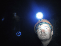 A Kyrgyz man works in a mine in Markay on May 20, 2009. No place on earth is blacker than the heart of a coal mine, especially one without lamps or for that matter power tools or even oxygen masks.The walls of this Soviet-era mine, pregnant with coal, barely reflect …