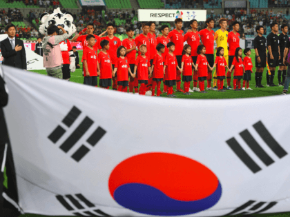 South Korea team players (red) sing their national anthem prior to a friendly football match between South Korea and Honduras in Deagu on May 28, 2018. - World Cup-bound South Korea defeated Honduras 2-0 in the friendly match. (Photo by Jung Yeon-je / AFP) (Photo credit should read JUNG YEON-JE/AFP/Getty …