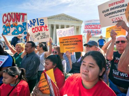 Immigration activists rally outside the Supreme Court as the justices hear arguments over the Trump administration’s plan to ask about citizenship on the 2020 census, in Washington, Tuesday, April 23, 2019. J. Scott Applewhite | AP