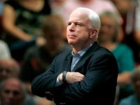 In this Aug. 25, 2009 file photo, Sen. John McCain, R-Ariz., holds a healthcare town hall meeting in Sun City, Ariz. McCain's family says the Arizona senator has chosen to discontinue medical treatment for brain cancer. (AP Photo/Matt York)