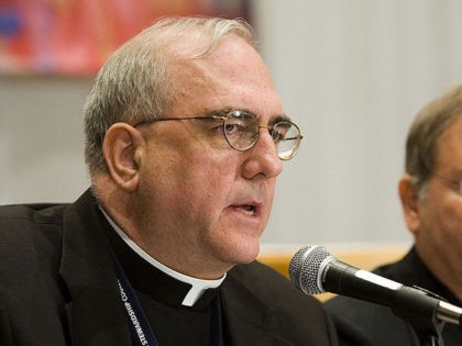 Baltimore, UNITED STATES: Archbishop of Kansas City, Kansas Josep Naumann (L) speaks at a press conference during a break from the fall meetings of the United States Conference of Catholic Bishops (USCCB) 13 November, 2006 in Baltimore, Maryland. The group of bishops from around the United States will discuss and …