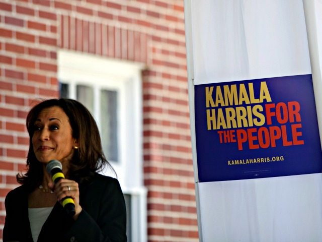 US Senator and Democratic presidential candidate Kamala Harris speaks to a porch full of s