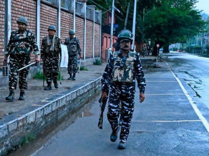 Security personnel patrol during a lockdown in Srinagar on August 10, 2019. (Photo by Taus