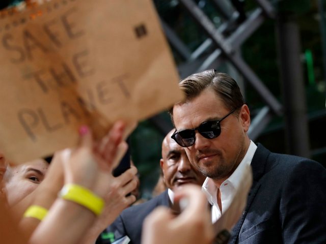 US actor Leonardo DiCaprio signs autographs as he arrives for the German Premiere of US director Quentin Tarantino's latest film "Once Upon A Time In Hollywood" in Berlin on August 1, 2019. (Photo by Odd ANDERSEN / AFP) (Photo credit should read ODD ANDERSEN/AFP/Getty Images)