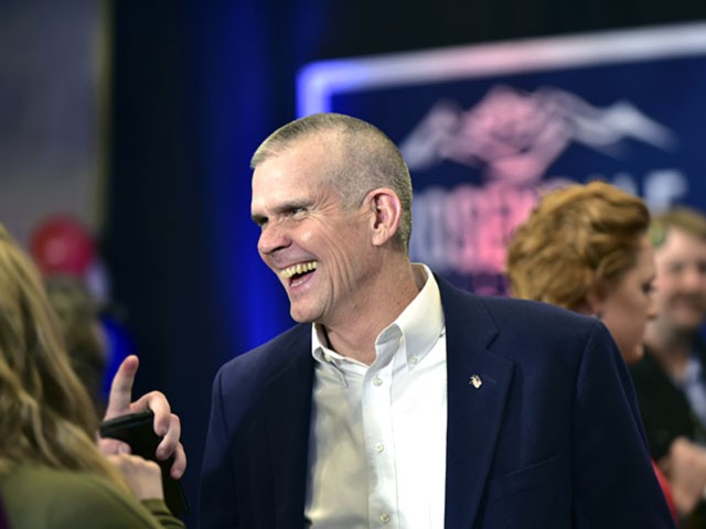 Republican Senate candidate Matt Rosendale talks with supporters Tuesday, Nov. 6, 2018 at the Delta Hotel in Helena, Mont., as he and his supporters wait for the poll results. (AP Photo/ Eliza Wiley)